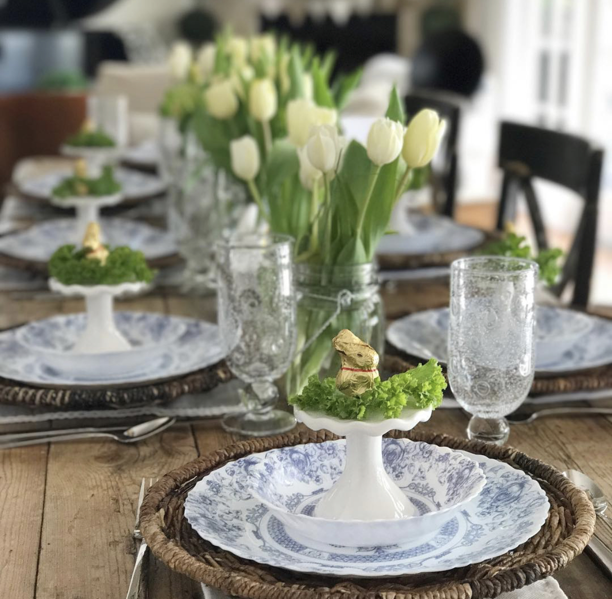 beautiful spring tablescape with tulips and blue and white plates