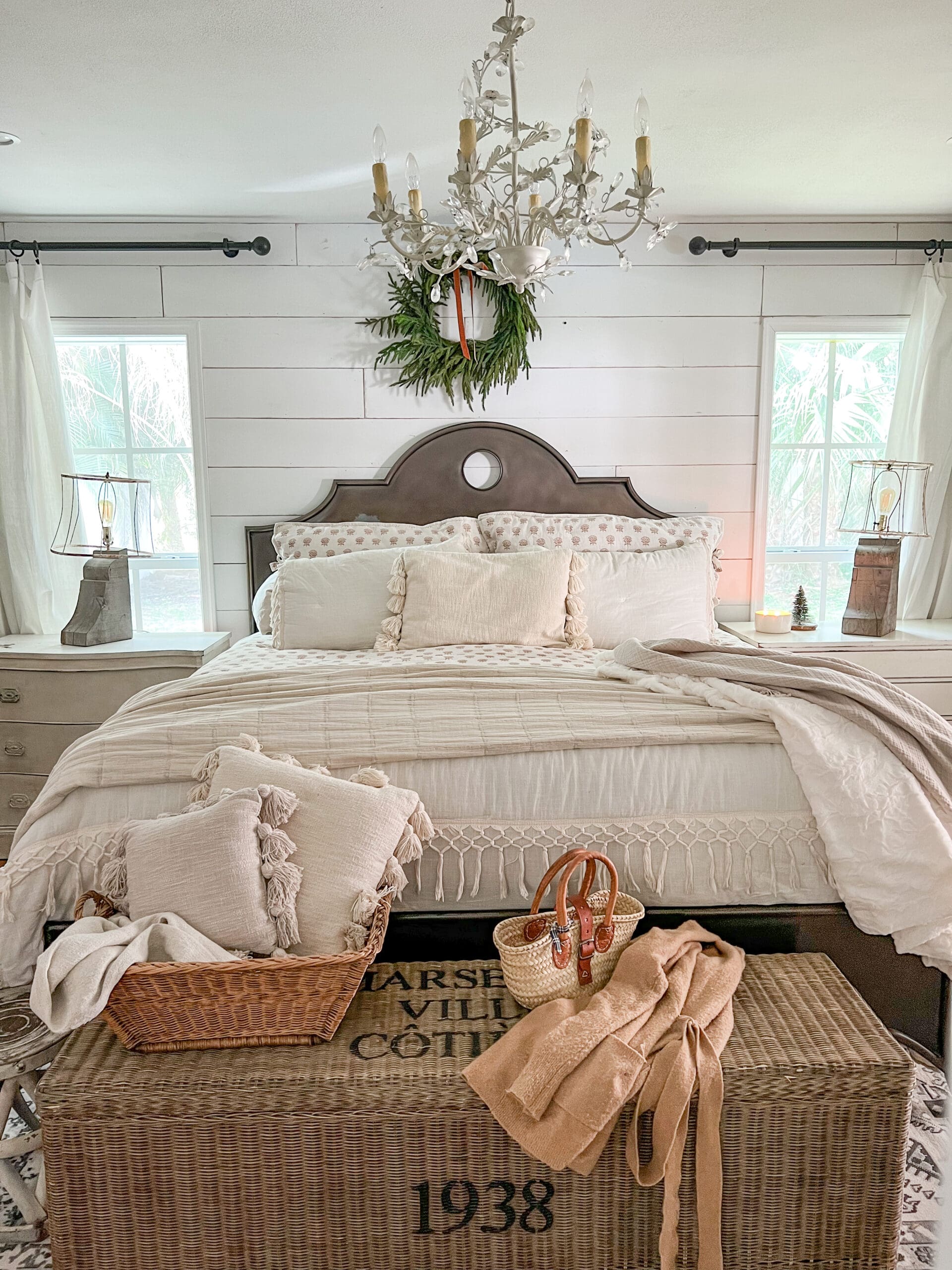 picture of a beautiful neutral bedroom featuring two lamps made out of architectural salvage pieces