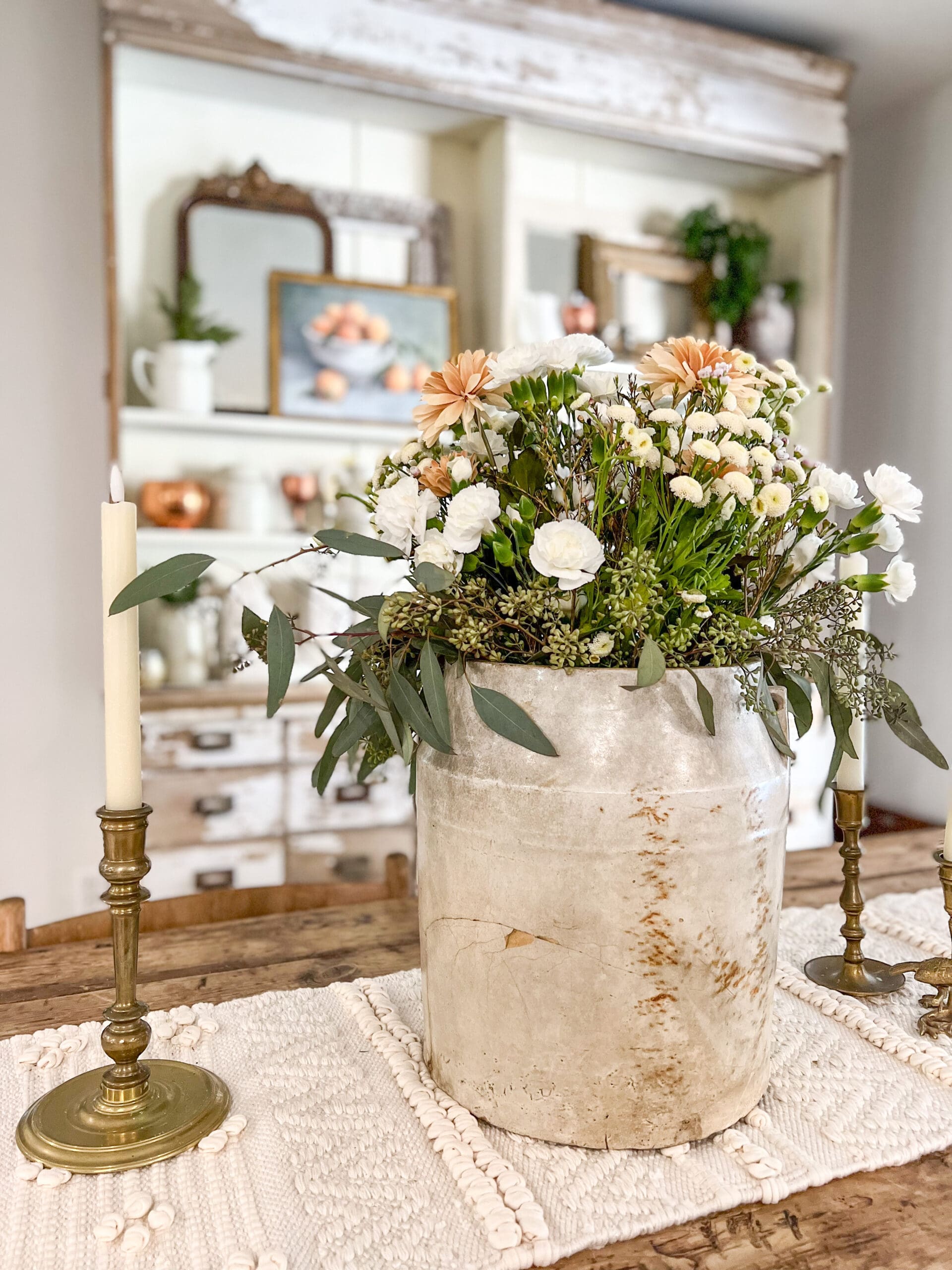 beautiful spring arrangement in ironstone vase as a table centerpiece