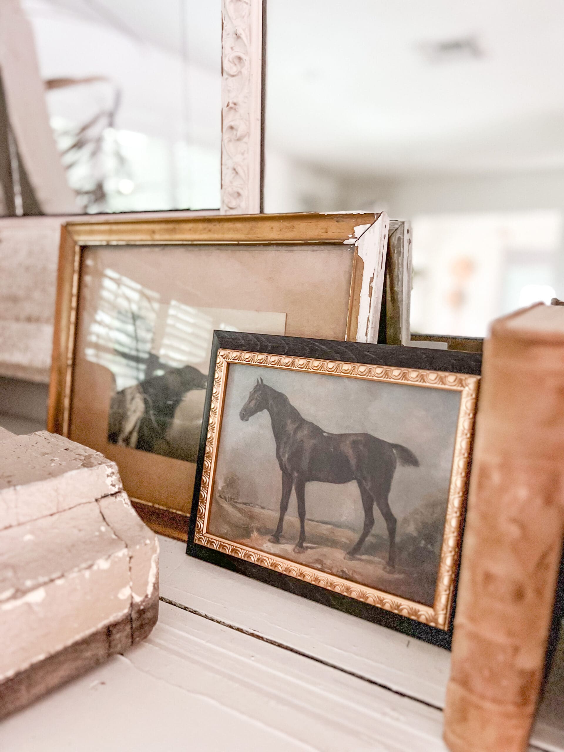 Close up of artwork of a horse in a small black frame