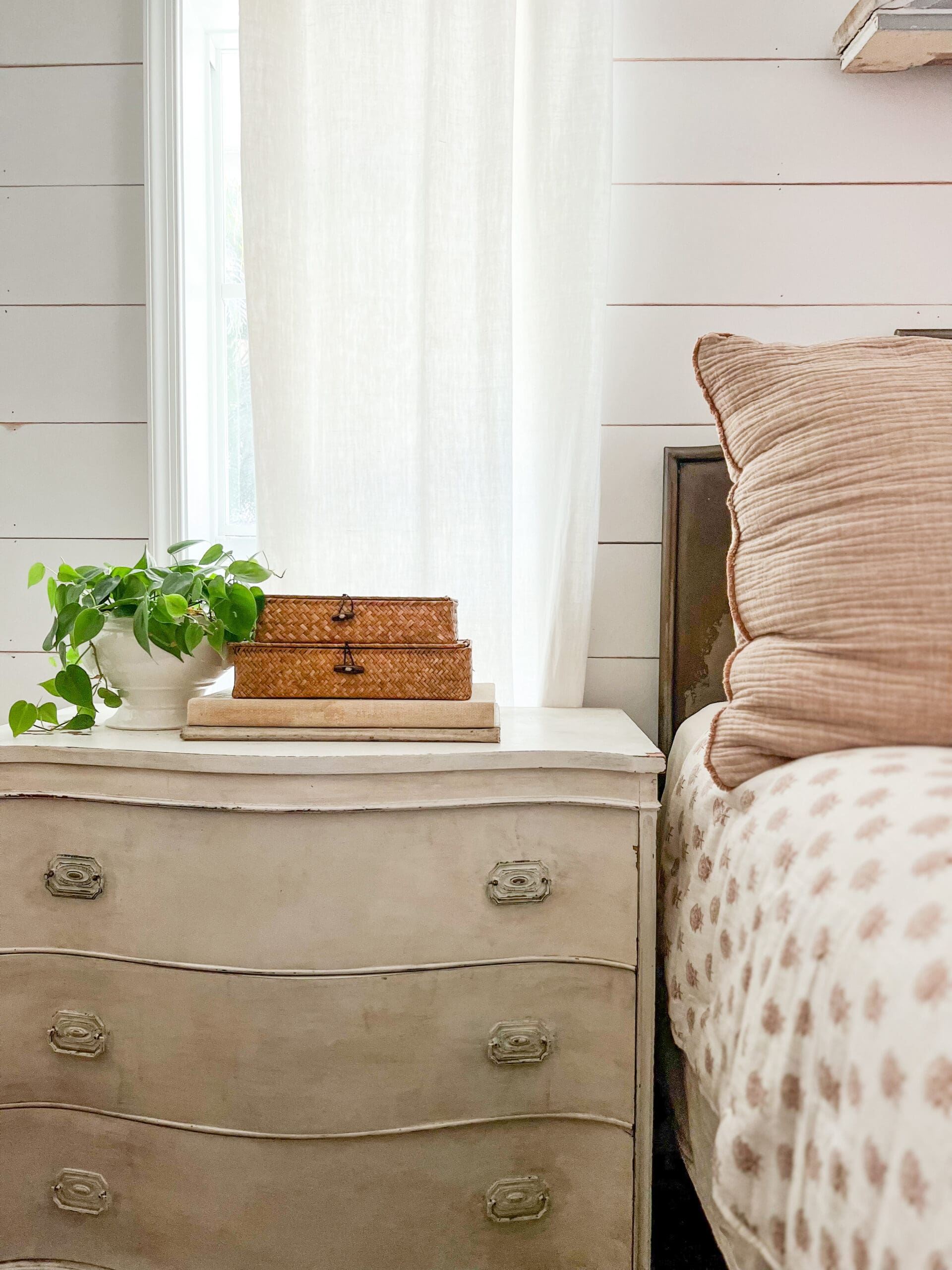 small rectangular baskets stacked on top of each other on a nightstand