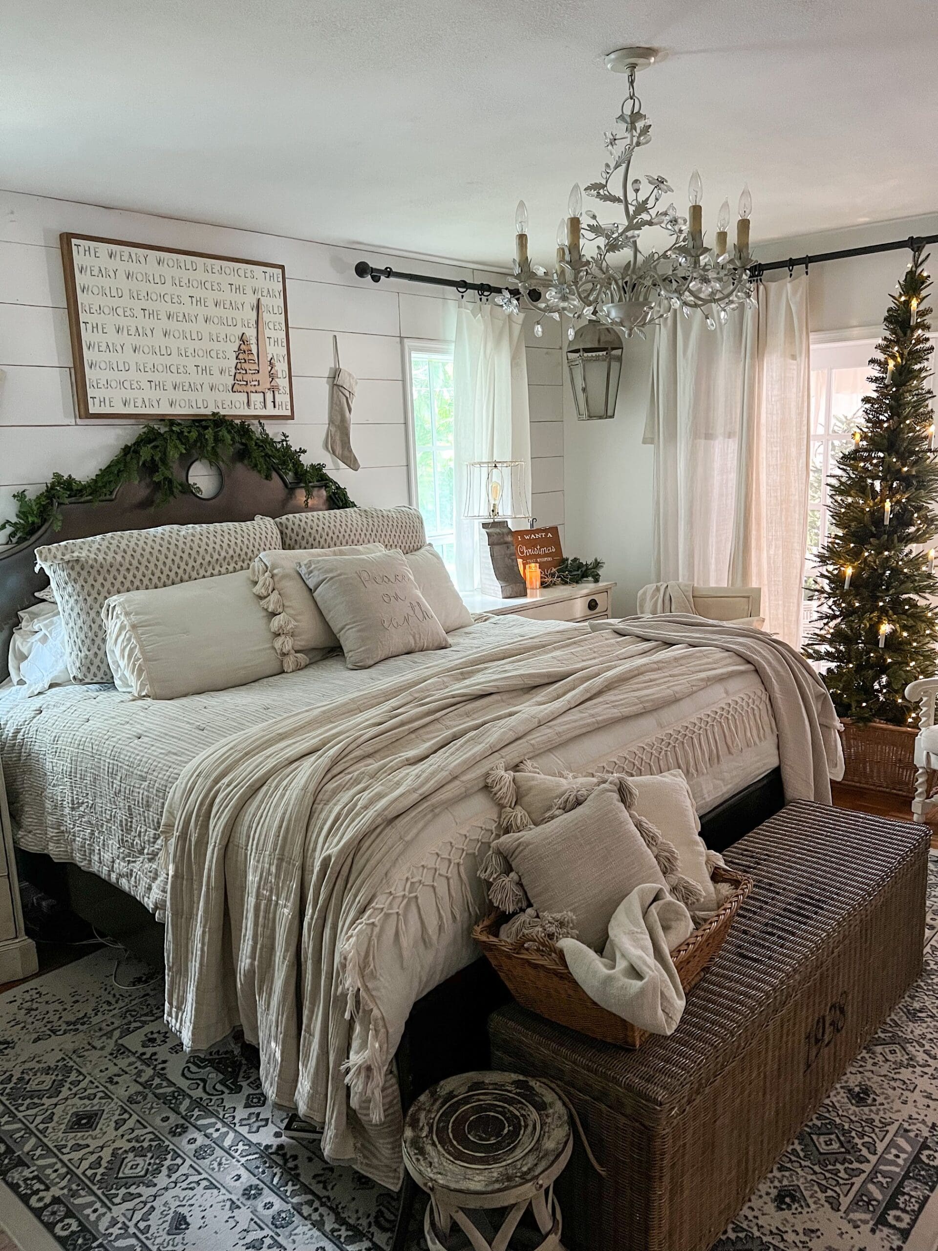 tall, narrow Christmas tree in a master bedroom styled for Christmas