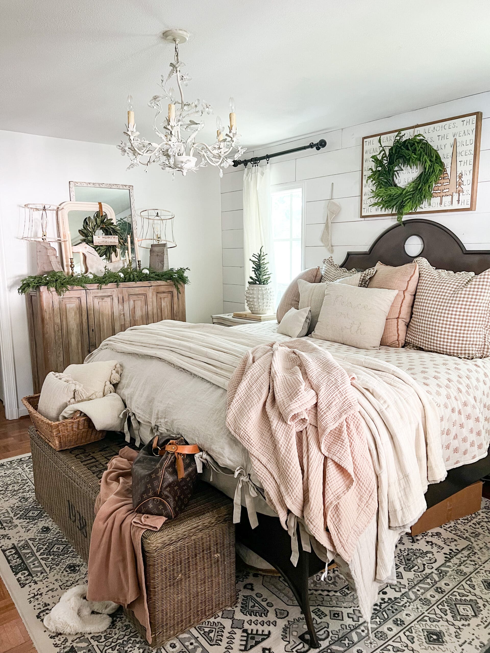 overview of a cozy bedroom styled for Christmas