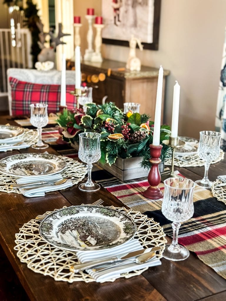 Christmas tablescape with candlesticks and plaid place mats