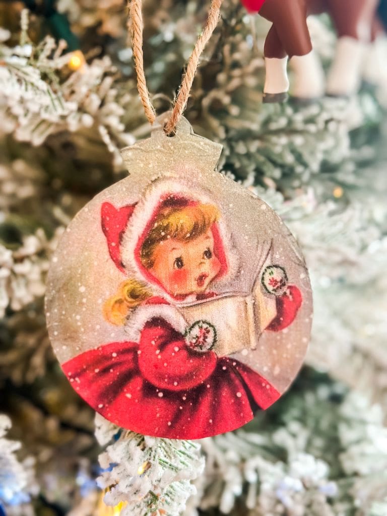 DIY vintage ornament of a little girl dressed up for Christmas