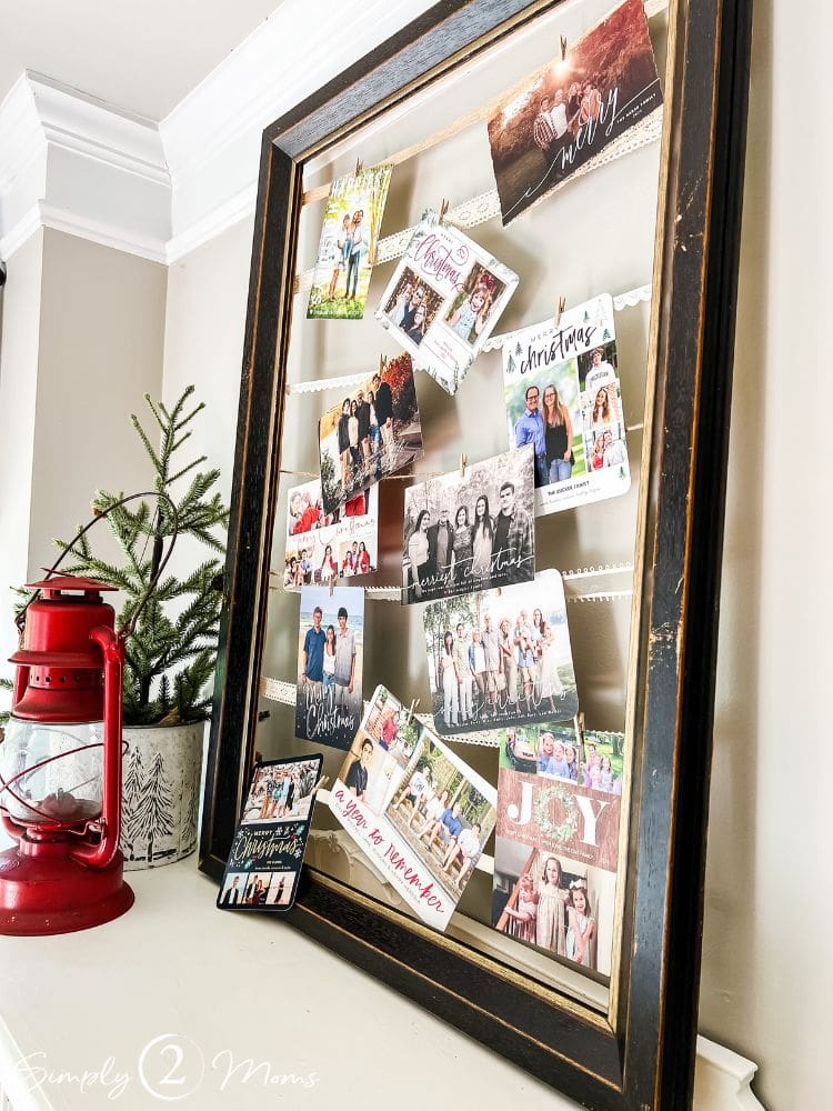 DIY frame with strips to clip Christmas cards with, making a beautiful Christmas card display