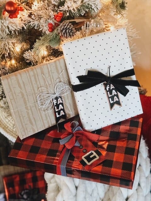gifts wrapped in various wrapping papers with falalala tags