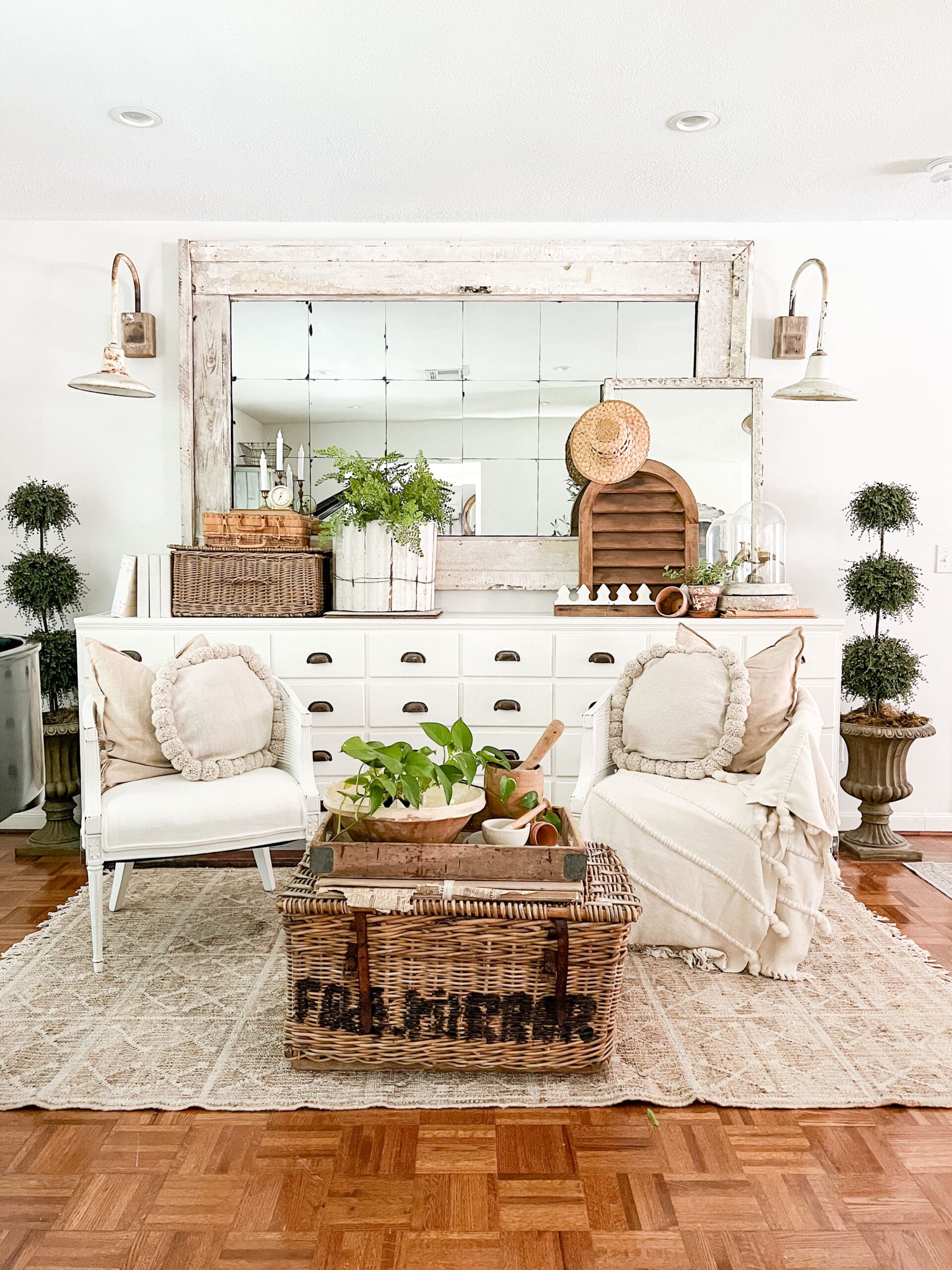 spring music room styled with lots of greenery, wicker baskets, and a swan