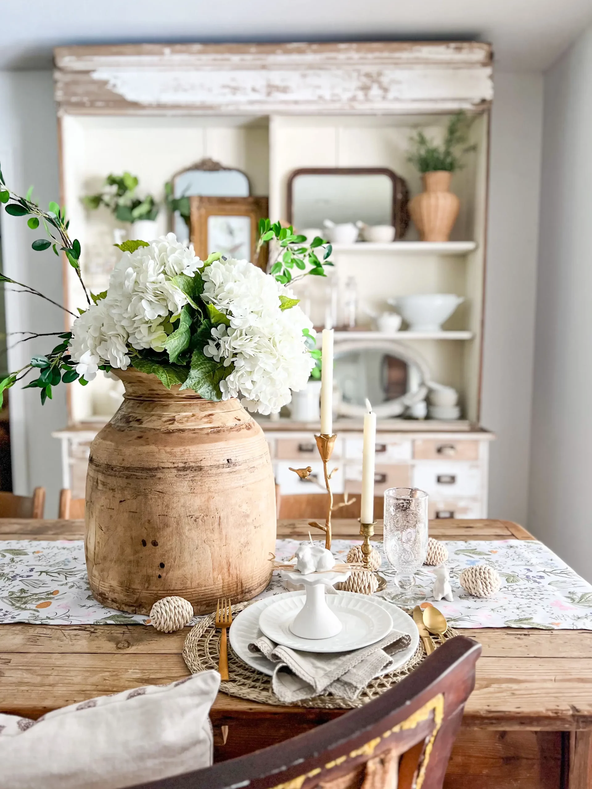 beautiful tablescape for spring with faux hydrangeas and white flatware