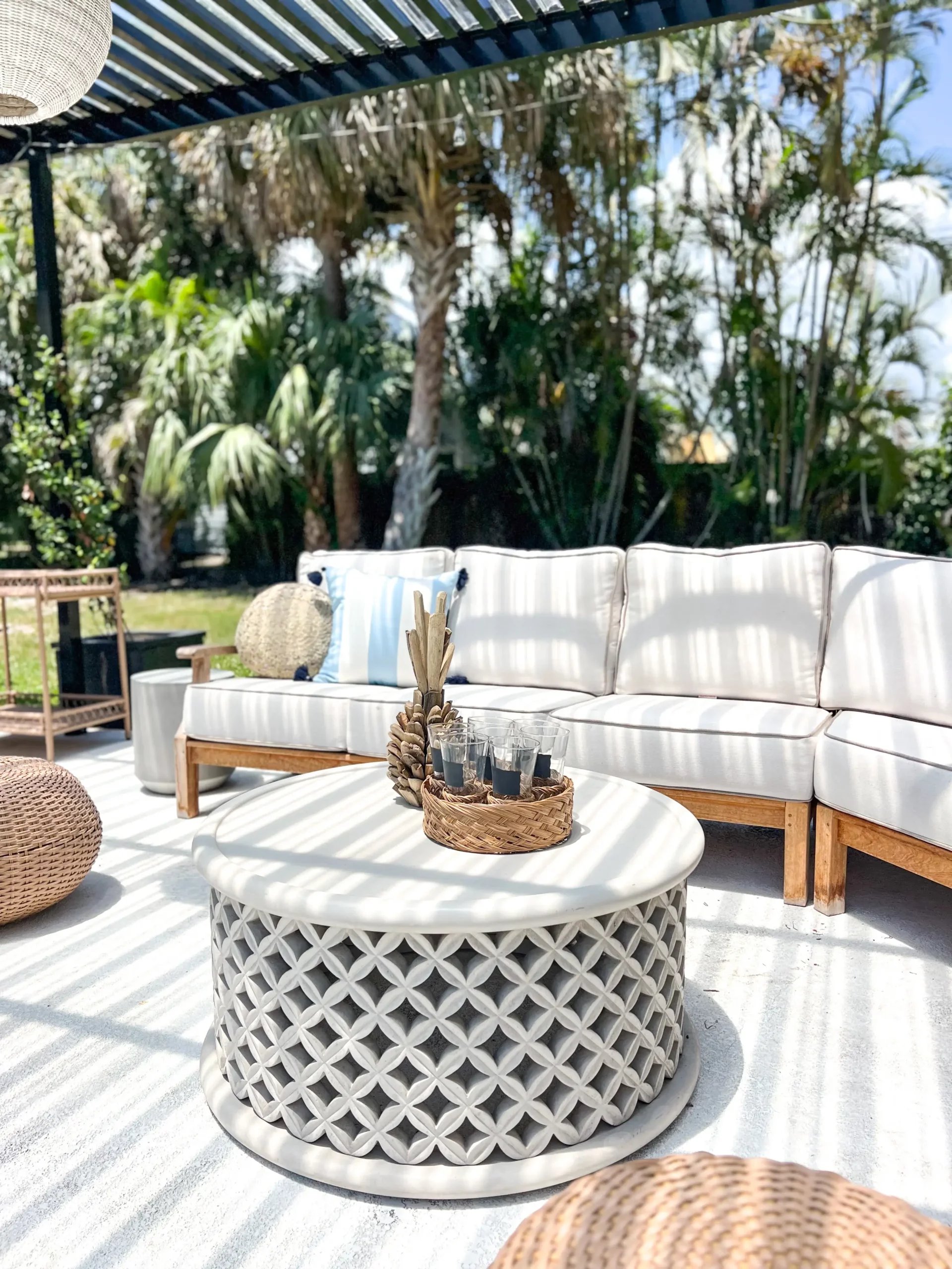 gorgeous concrete patio coffee table with a beautiful summer vignette on top