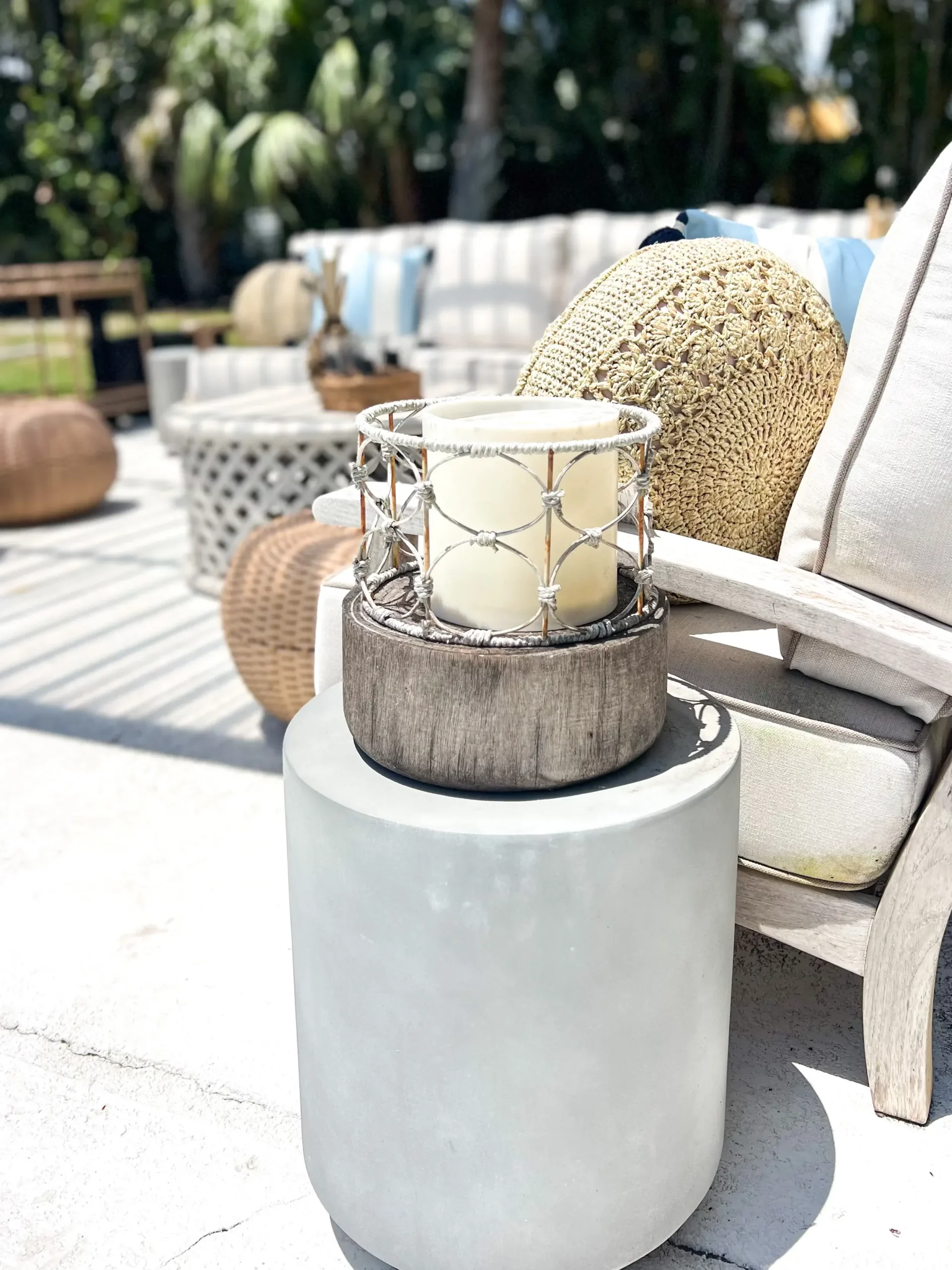 concrete side table with a wooden lantern outside